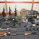 This image provided by the U.S. District Court in Maryland shows a photo of firearms and ammunition that was in the motion for detention pending trial in the case against Christopher Paul Hasson. Prosecutors say that Hasson, a Coast Guard lieutenant is a “domestic terrorist” who wrote about biological attacks and had a hit list that included prominent Democrats and media figures.